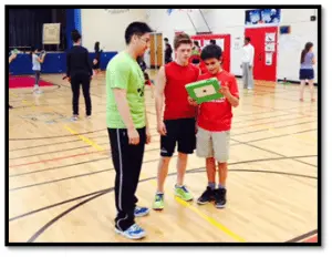 Students using equipment in gym