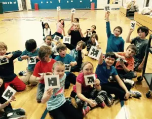 Students using plickers in PE