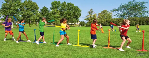 Students hitting balls off tee