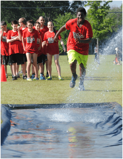 Student preparing to use slip and slide