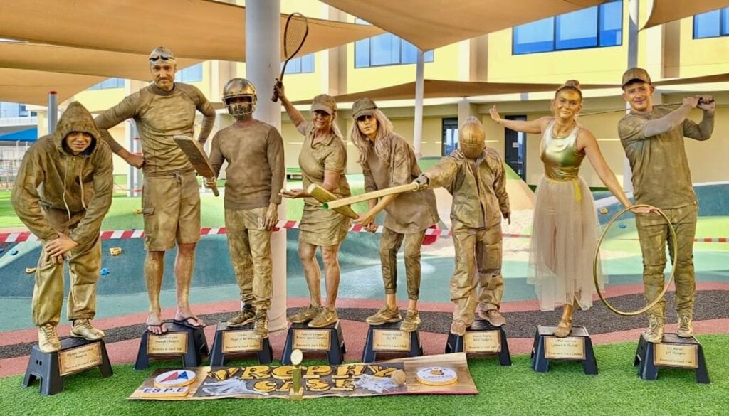The GEMS Physical Education department dressed up as sports trophies for Halloween