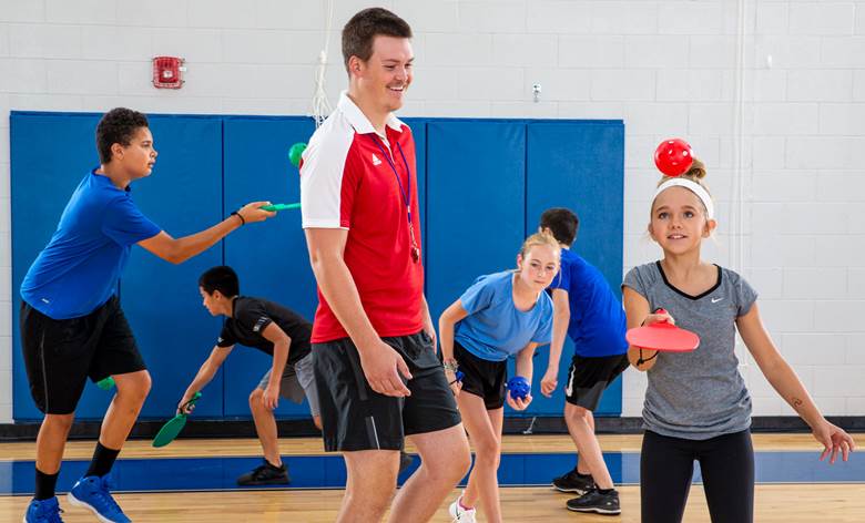 PE Teacher teaching Pickleball